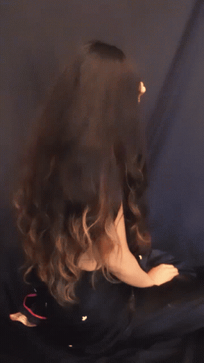 Woman In Black Bra Looking Over Shoulder GIF