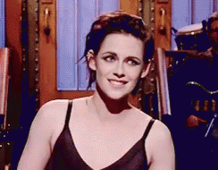 Woman In Black Bra Smiling With Drummer GIF