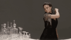 Woman In Black Breaking The Glasses On The Table GIF