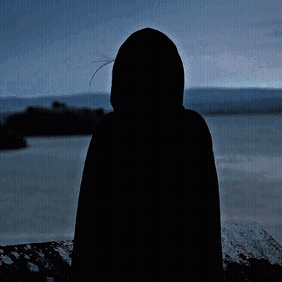 Woman In Black Cape Hugging Someone GIF