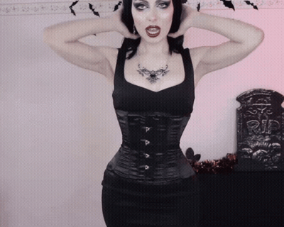 Woman In Black Corset With P Necklace GIF