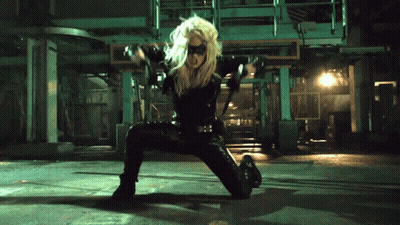 Woman In Black Costume Kneeling GIF