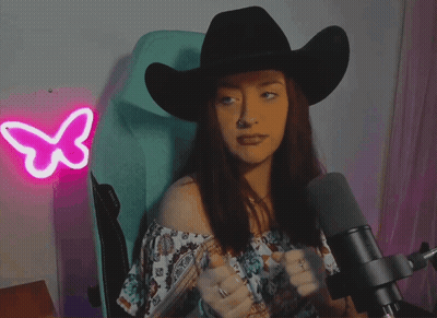 Woman In Black Cowboy Hat At Microphone GIF