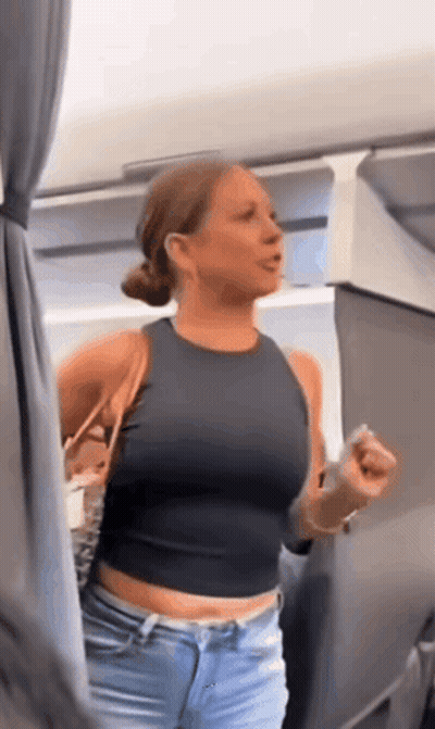 Woman In Black Crop Top And Blue Jeans Standing In Room GIF