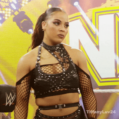 Woman In Black Crop Top And Fishnets By Yellow Sign N GIF