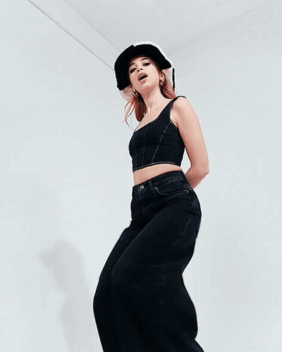 Woman In Black Crop Top And Jeans Dancing GIF