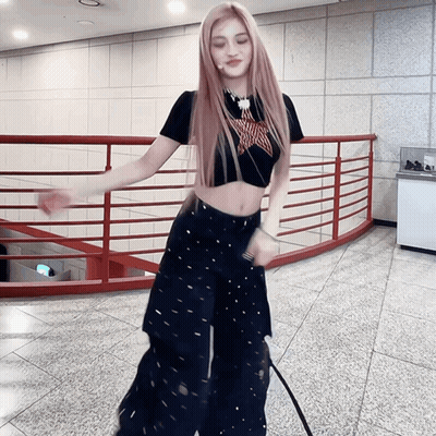 Woman in Black Crop Top and Pants Dancing