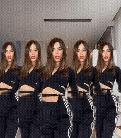 Woman In Black Crop Top And Pants Standing In Row GIF