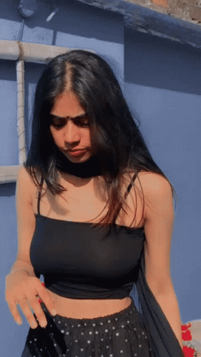 Woman In Black Crop Top And Polka Dot Skirt GIF