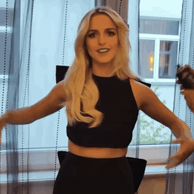 Woman In Black Crop Top And Skirt Standing GIF