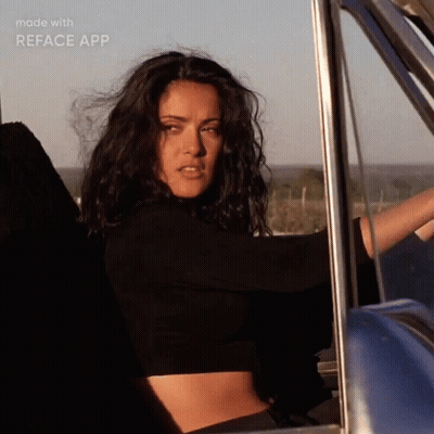 Woman In Black Crop Top Driving Blue Truck GIF
