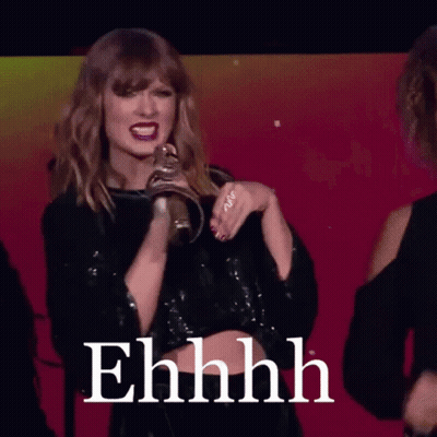 Woman In Black Crop Top With Ehhhh On Screen GIF