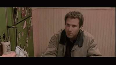 Woman In Black Dress And Earrings Making Funny Face Pointing GIF