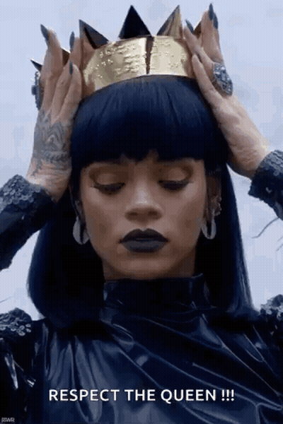 Woman In Black Dress And Gold Crown Holding Head GIF