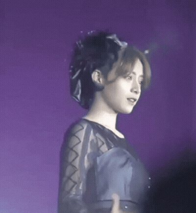 Woman In Black Dress And Hat On Stage GIF