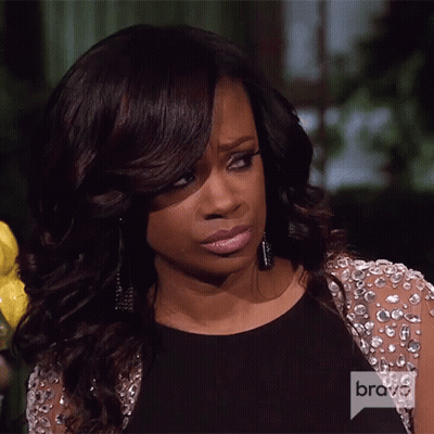 Woman In Black Dress And Jacket With Bravo On Sleeve GIF