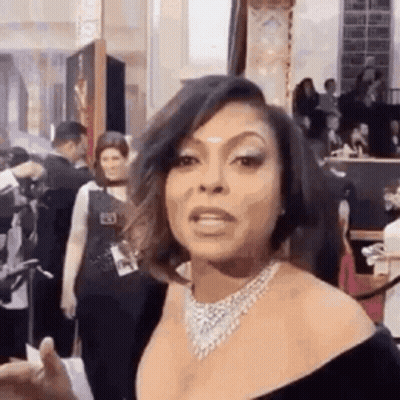 Woman In Black Dress And Necklace GIF