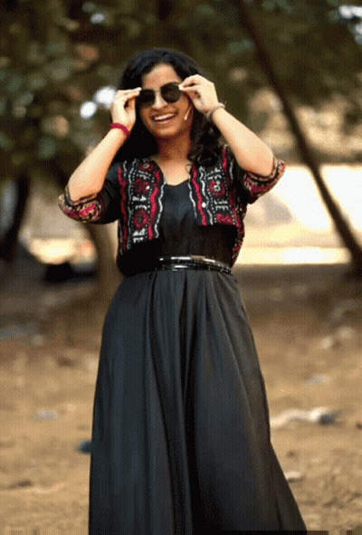 Woman In Black Dress And Red Black Jacket GIF