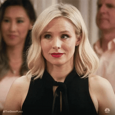 Woman in Black Dress and Red Lipstick Looking at Camera