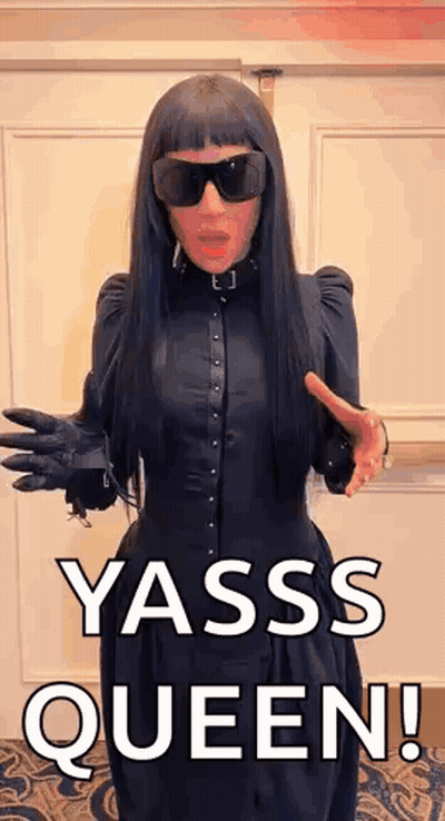 Woman In Black Dress And Sunglasses Saying Yasss Queen GIF
