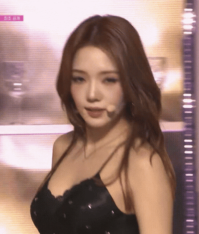 Woman In Black Dress At Microphone GIF
