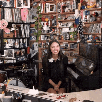 Woman In Black Dress At Piano GIF