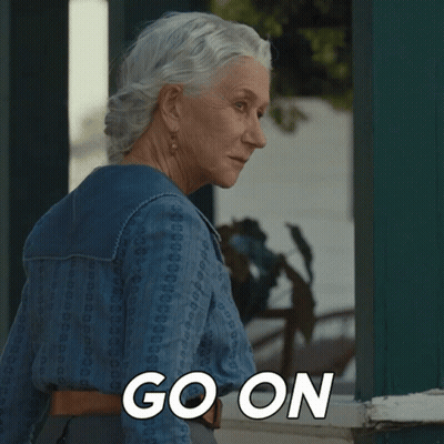 Woman In Black Dress At Table Says Hell Is Frosty GIF