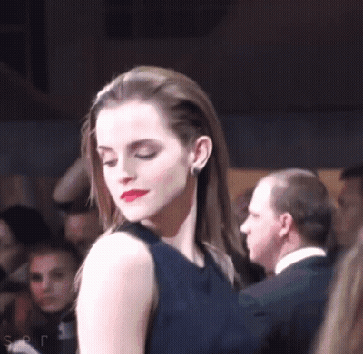 Woman In Black Dress Before Crowd GIF