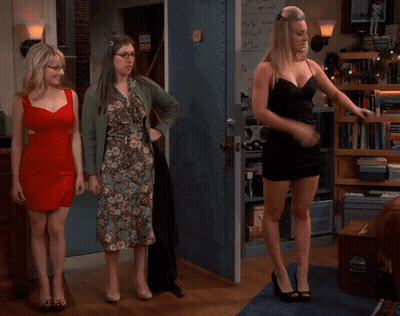 Woman In Black Dress By Door Sign A GIF