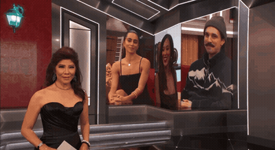 Woman In Black Dress By Screen With Man And Two Women GIF
