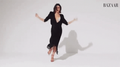 Woman In Black Dress Dancing Arms Outstretched GIF