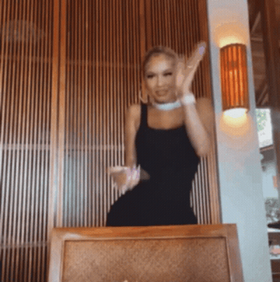 Woman In Black Dress Dancing In Chair GIF