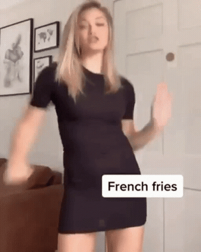 Woman In Black Dress Dancing With French Fries GIF