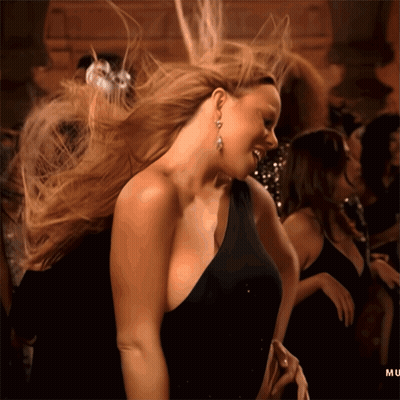 Woman In Black Dress Dancing With Hair Blowing GIF