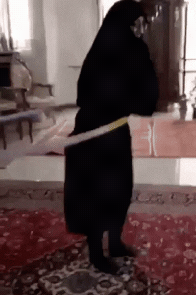 Woman In Black Dress Dancing With Hula Hoop GIF