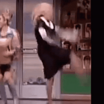 Woman In Black Dress Dancing With Man GIF