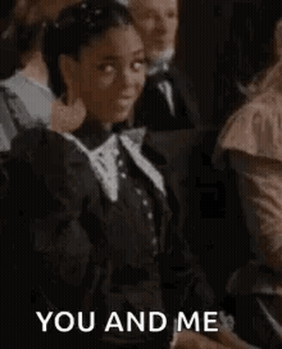 Woman In Black Dress Fist Bump To Crowd GIF