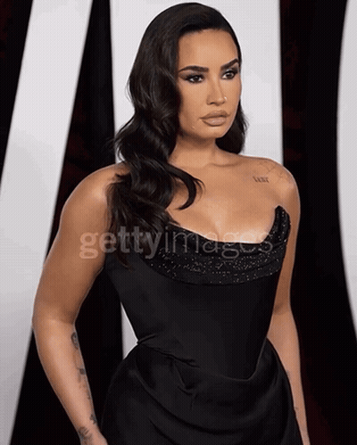 Woman In Black Dress Getty Images GIF