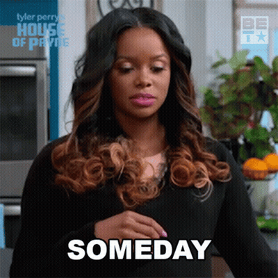 Woman In Black Dress Holding Belly Saying Someday GIF
