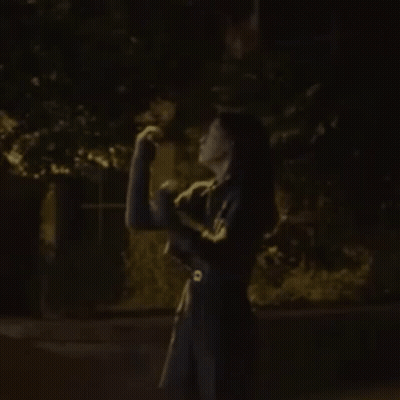 Woman In Black Dress Holding Cat GIF