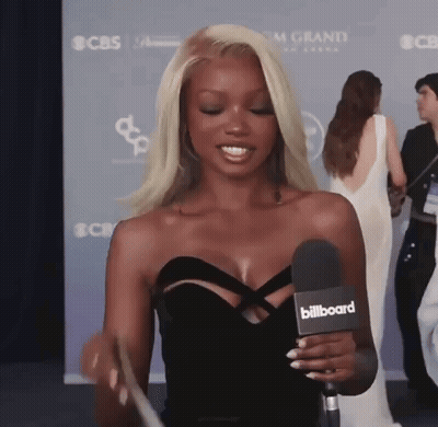 Woman In Black Dress Holding Microphone GIF