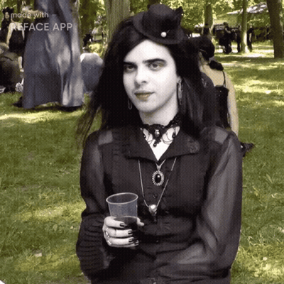 Woman In Black Dress Holding Plastic Cup GIF