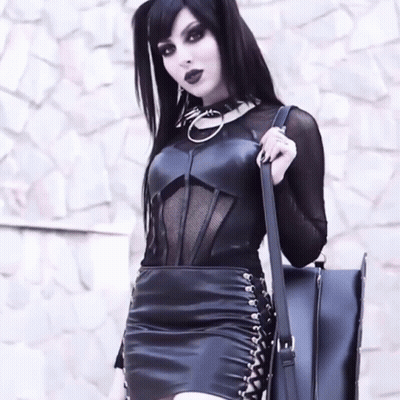 Woman In Black Dress Holding Purse GIF