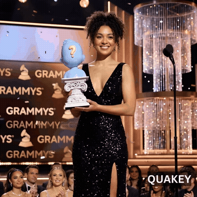 Woman In Black Dress Holding Question Mark Statue GIF