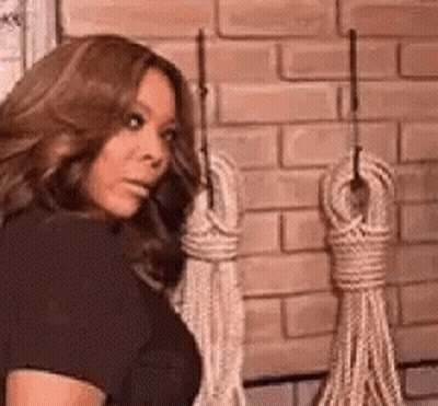 Woman In Black Dress Holding Ropes GIF