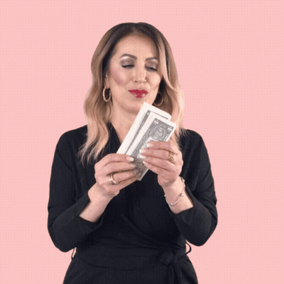 Woman in Black Dress Holding Stack of Money