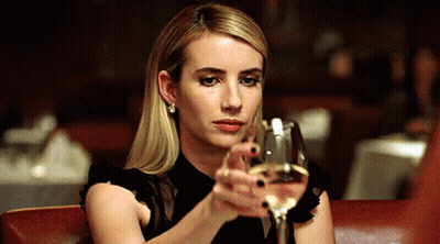 Woman In Black Dress Holding Wine GIF