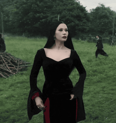 Woman In Black Dress In Field GIF