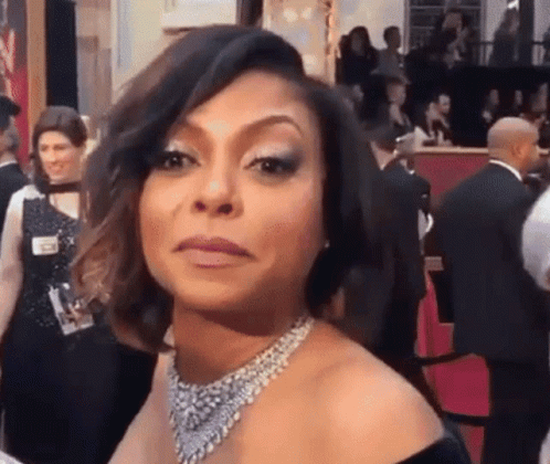 Woman In Black Dress Making Face GIF