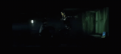 Woman In Black Dress Next To Man In Black Jacket GIF